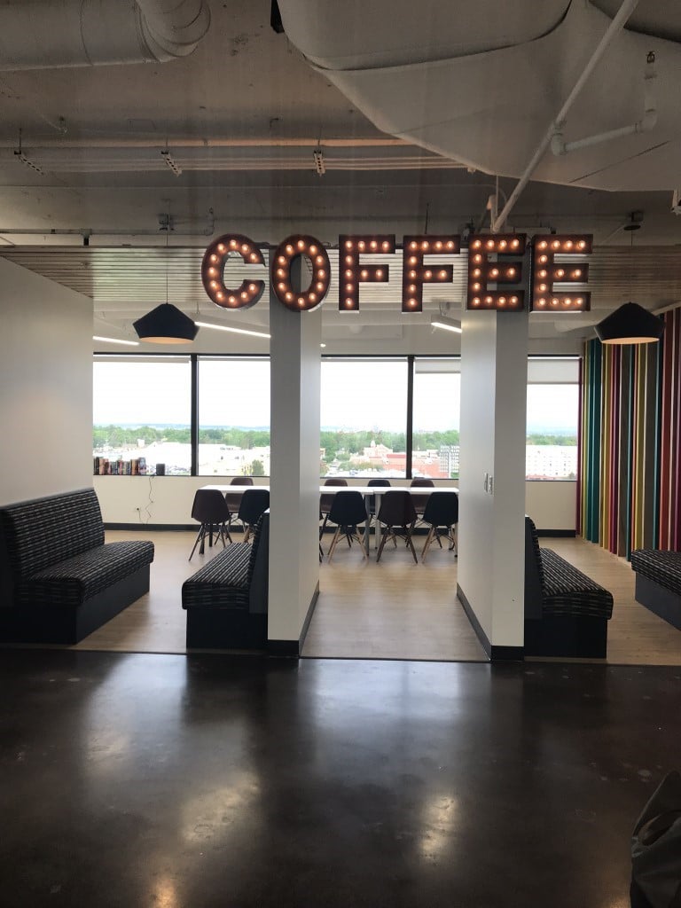 An office equipped with a coffee bar, and views of Infinity Park.